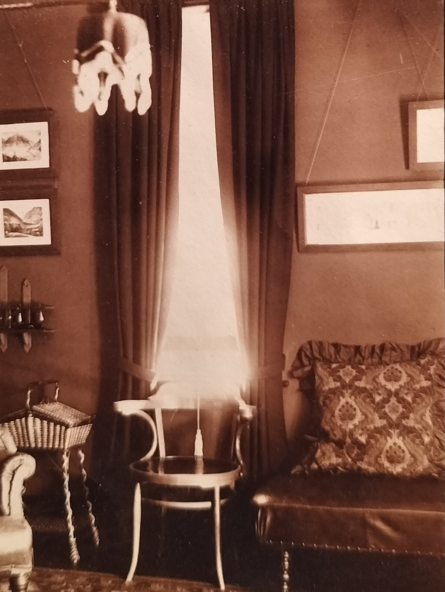  Opposite corner of the lounge. Note the manner in which photo or picture frames were hung in the earlier years. The long landscape frame in all probably holds another panoramic photograph