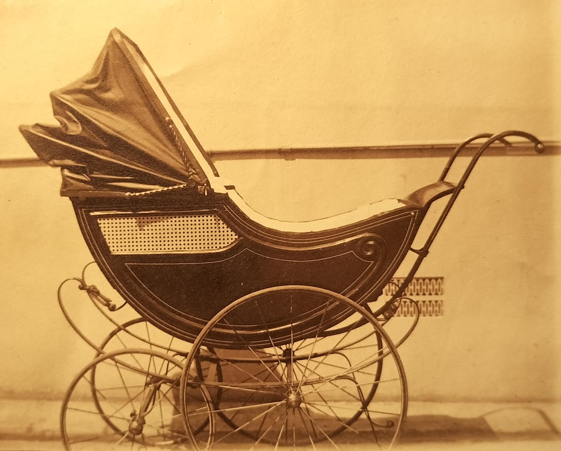 A pram that probably belonged to the grandchild of the occupants