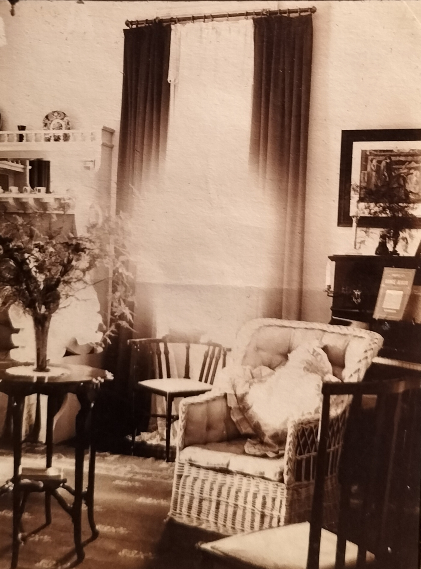 In the music room, with the piano on the right and the lover’s bench” on the left. The music sheet on the piano is different from the music sheet in another photograph below.