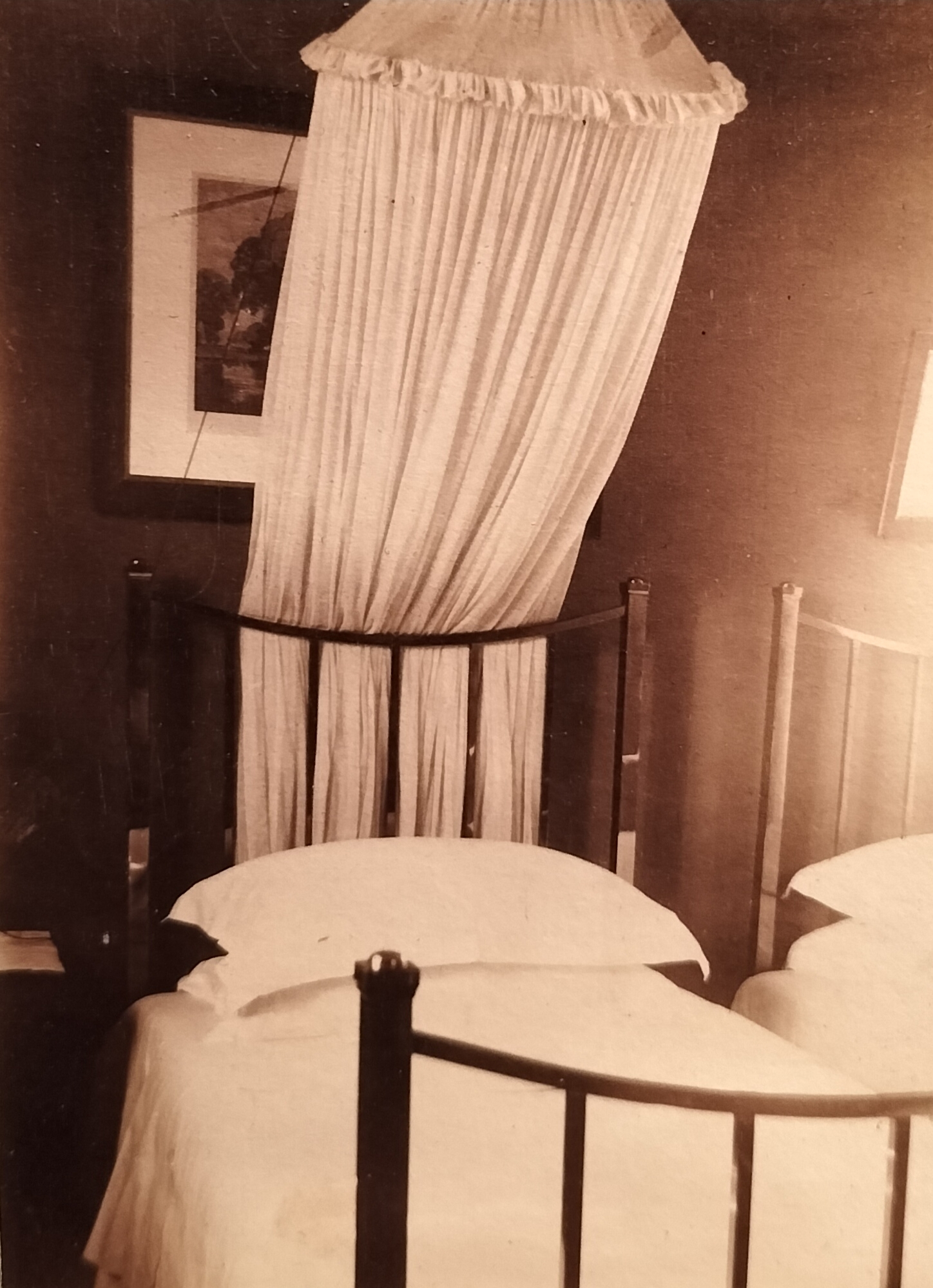 The second bedroom with two single steel-framed beds. Mosquito netting was clearly an important necessity.