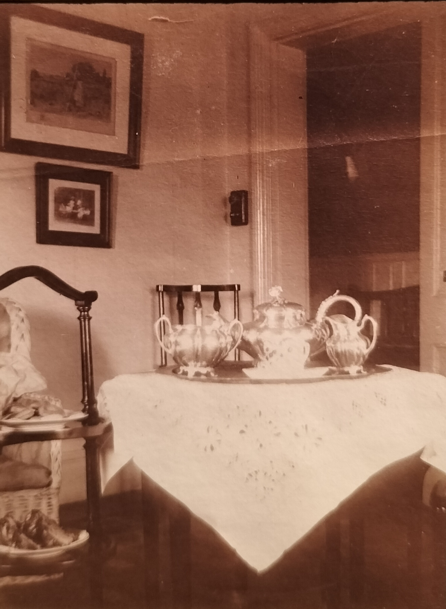 Tea corner in the house with all its silverware and tea caddy showing two plates with various titbits