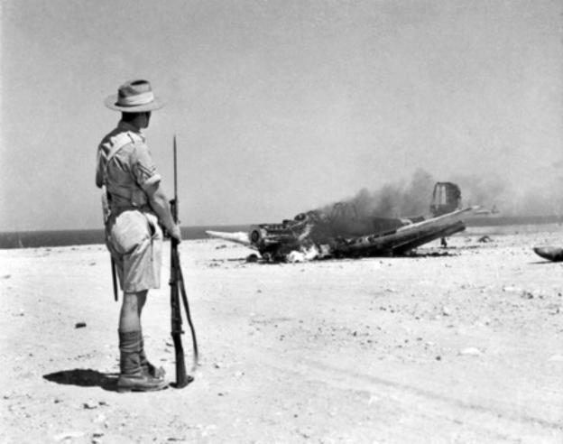 Ju 87 Stuka burning near Tobruk - via Wikipedia
