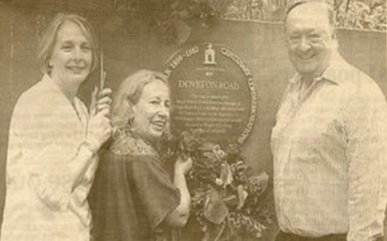 Den Adams Flo Bird installing the Doveton Road Plaque in the 1980s