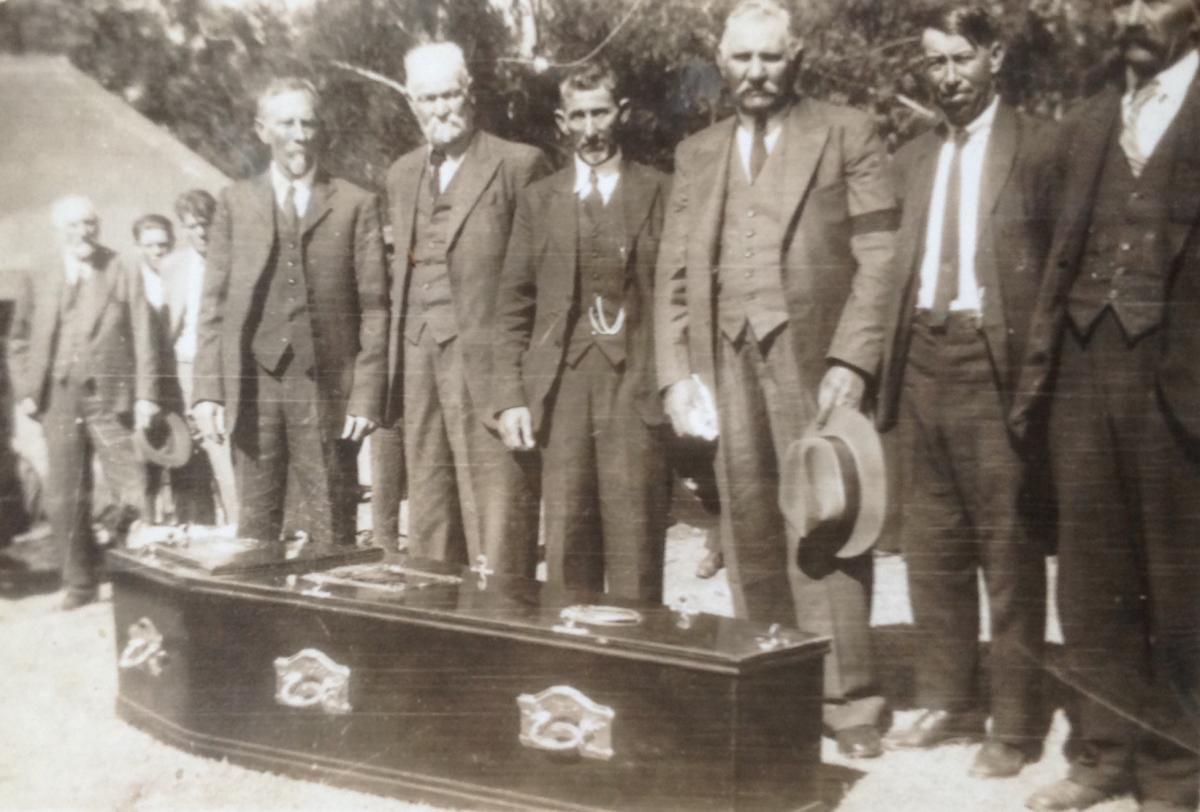 Men at the coffin of a family member circa 1920 via Carol Hardijzer