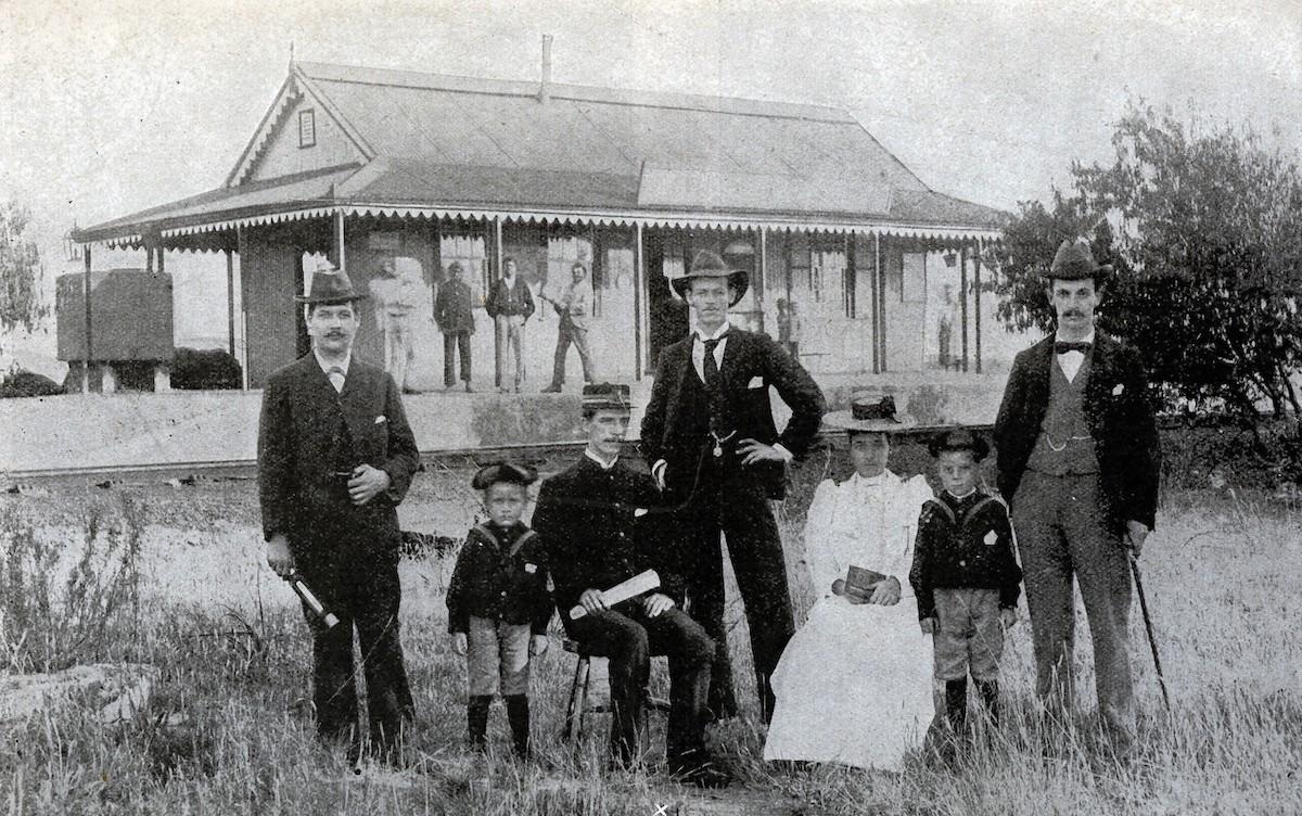 Stationmaster Atkinson with staff in front of Elandslaagte station 1899 via Talana Museum