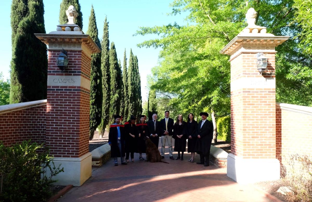 Faculty and Graduates at campus entrance - The South African Institute for Heritage Science and Conservation