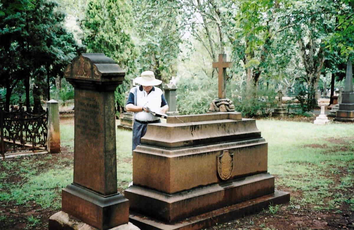 Inspecting a grave at the Brixton cemetery - Friends of the Cemeteries